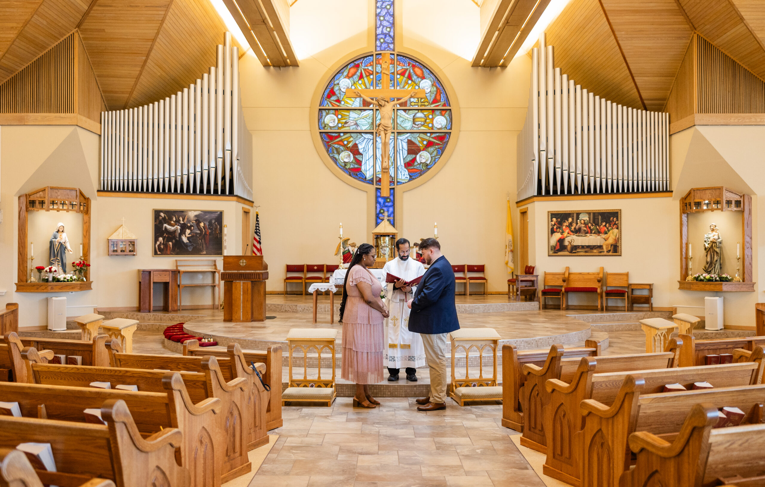 A Catholic couple in the midst of a betrothal ceremony at St. Catherine of Siena in Kennesaw, GA