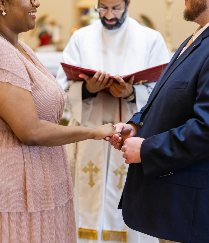 A Catholic couple in the midst of a betrothal ceremony at St. Catherine of Siena in Kennesaw, GA