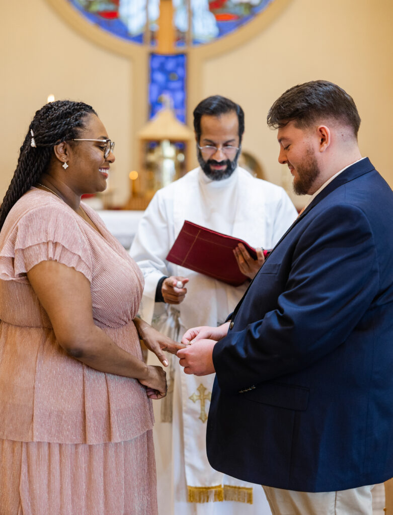 A Catholic couple in the midst of a betrothal ceremony at St. Catherine of Siena in Kennesaw, GA