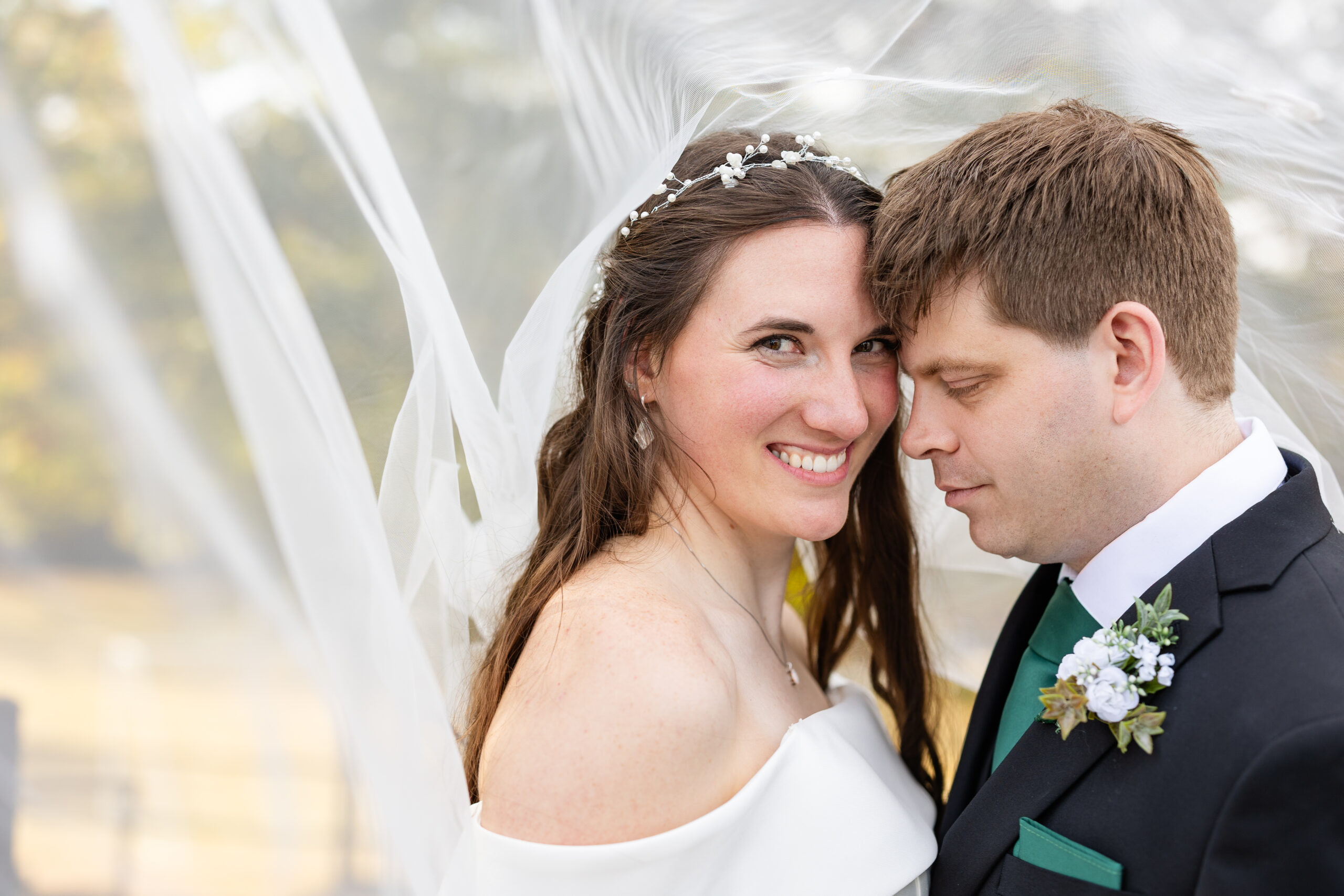 St. Benedict wedding bride and groom under veil