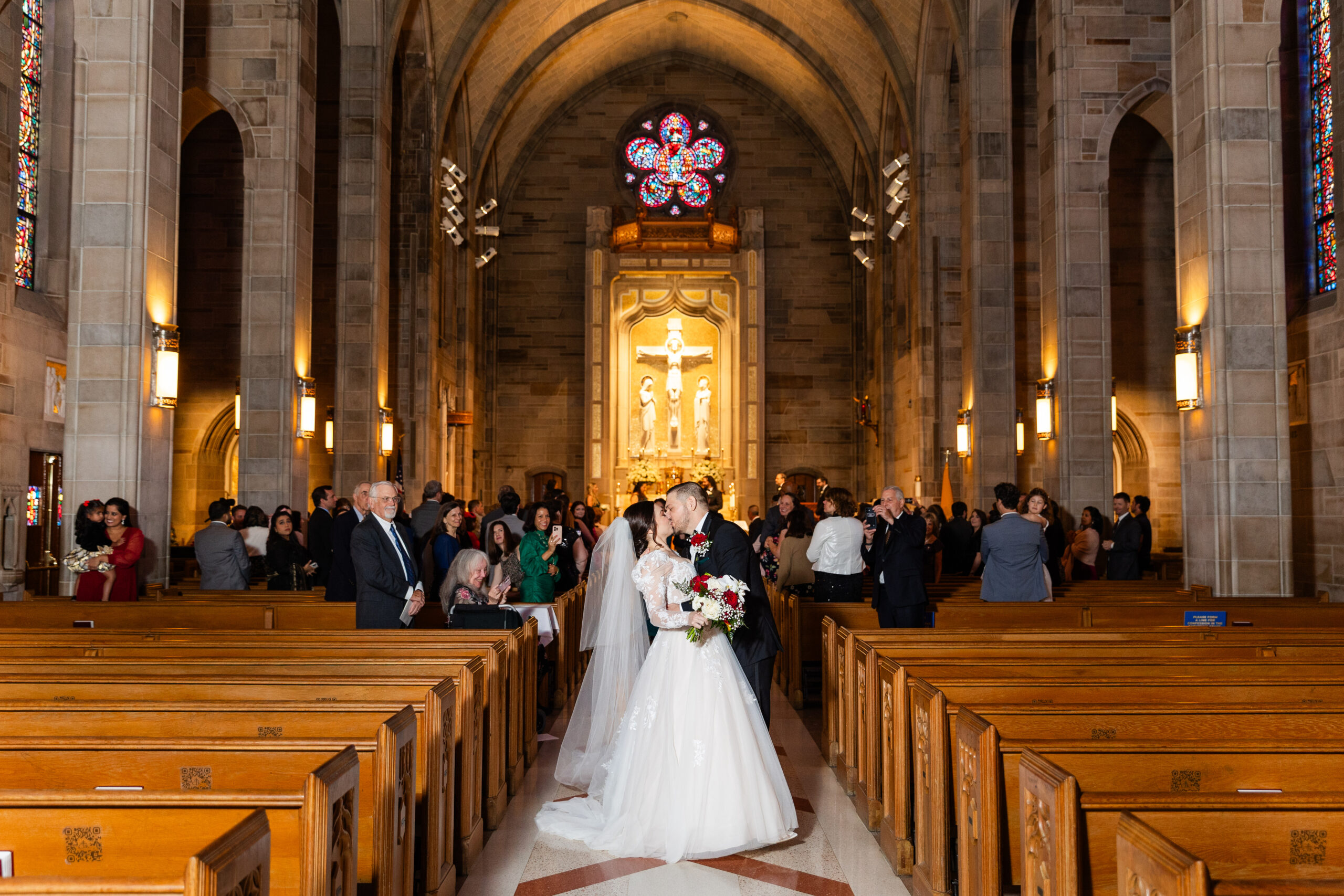 Cathedral of Christ the King wedding with bride and groom dipping in aisle