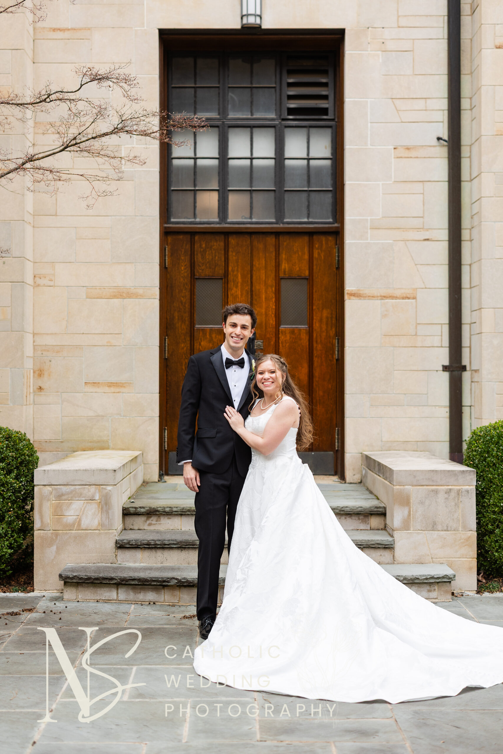 Christ the King wedding couple smiles at camera