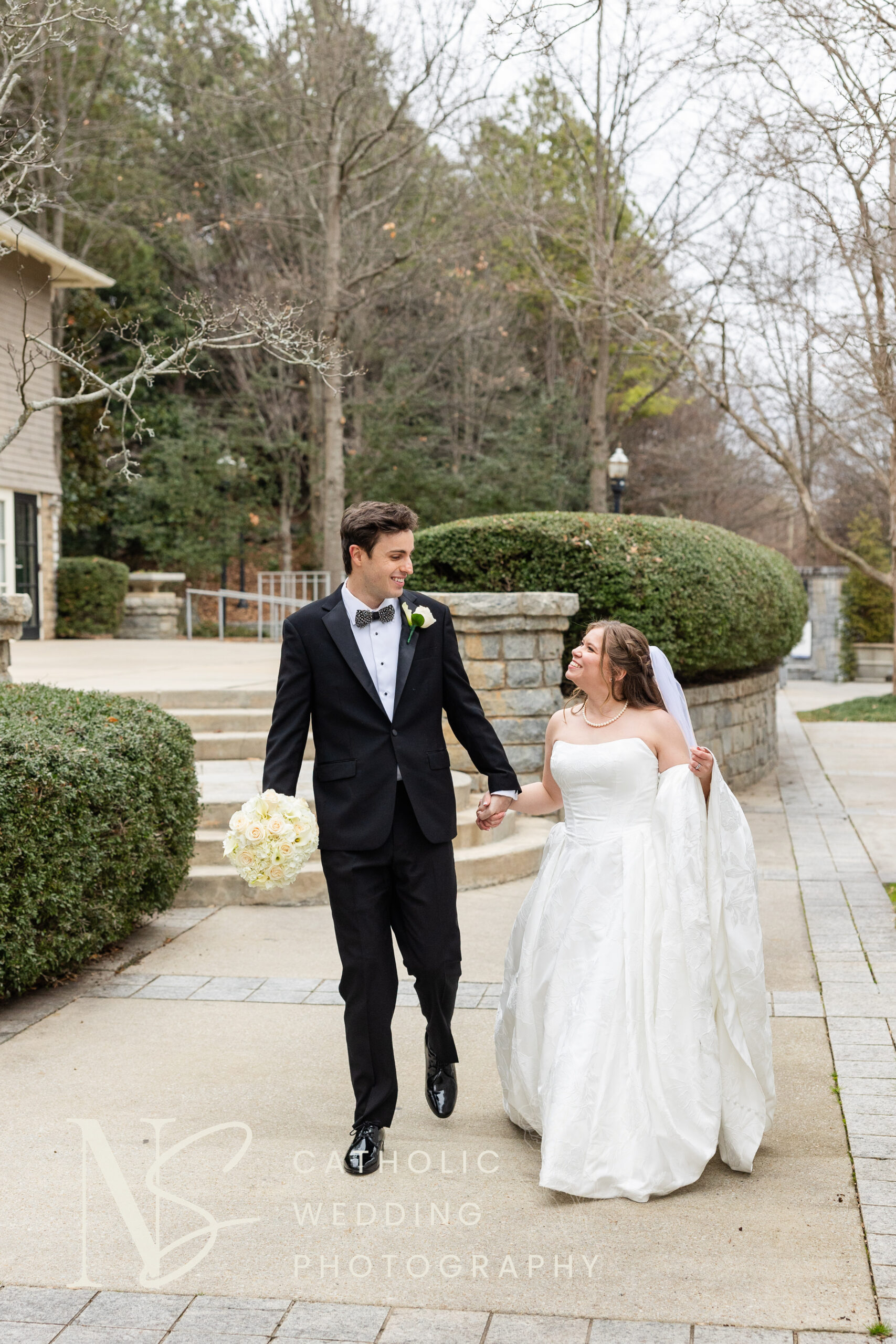 couple smiles at Piedmont Park on wedding day